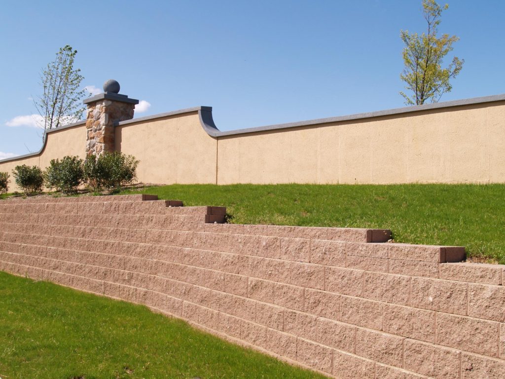 concrete brick barrier surrounded with grass